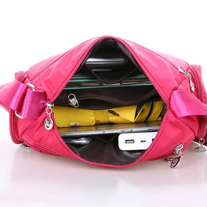 Women's nylon shoulder bag with multi-pocket design, zip opening and detachable handle in red, purple, black or army green
