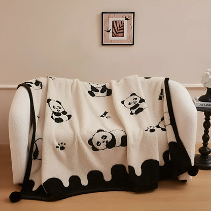 Black and white cationic panda pattern velvet blanket showing texture and modern design