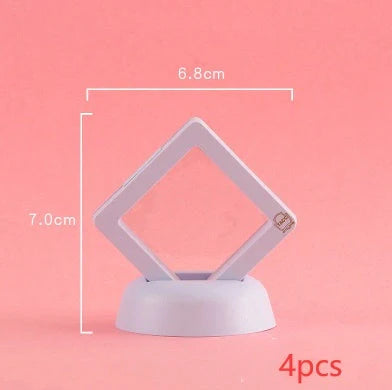 3D floating jewelry coin display stand in white and black, showcasing collectibles in mid-air