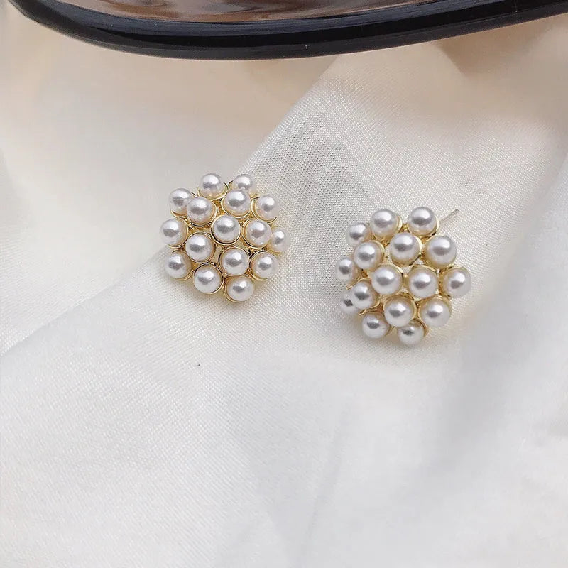 Korean style pineapple and starfish motif earrings with pearl accents in gold, silver, pearl flower, or starfish pearl finish.