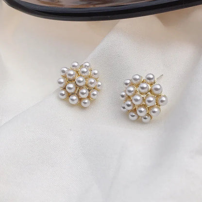 Korean style pineapple and starfish motif earrings with pearl accents in gold, silver, pearl flower, or starfish pearl finish.