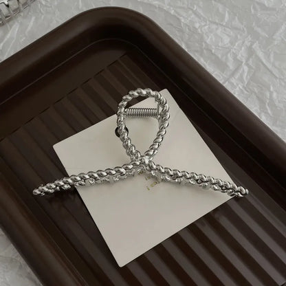 Silver metal hair claw barrette example from a range of 44 Korean-style designs.