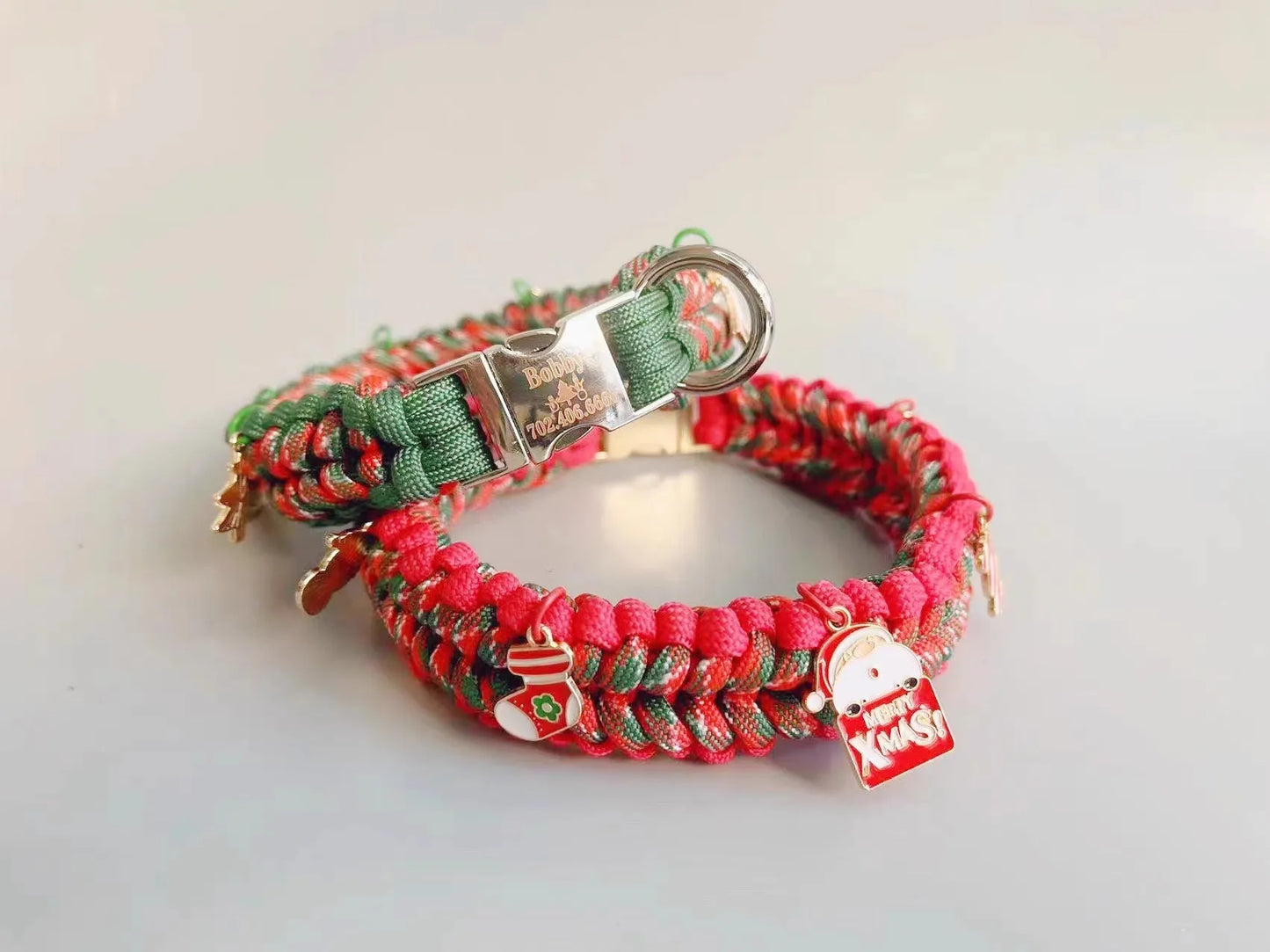 Green rope dog leash with P chain and a metal release buckle, held in a person's hand.