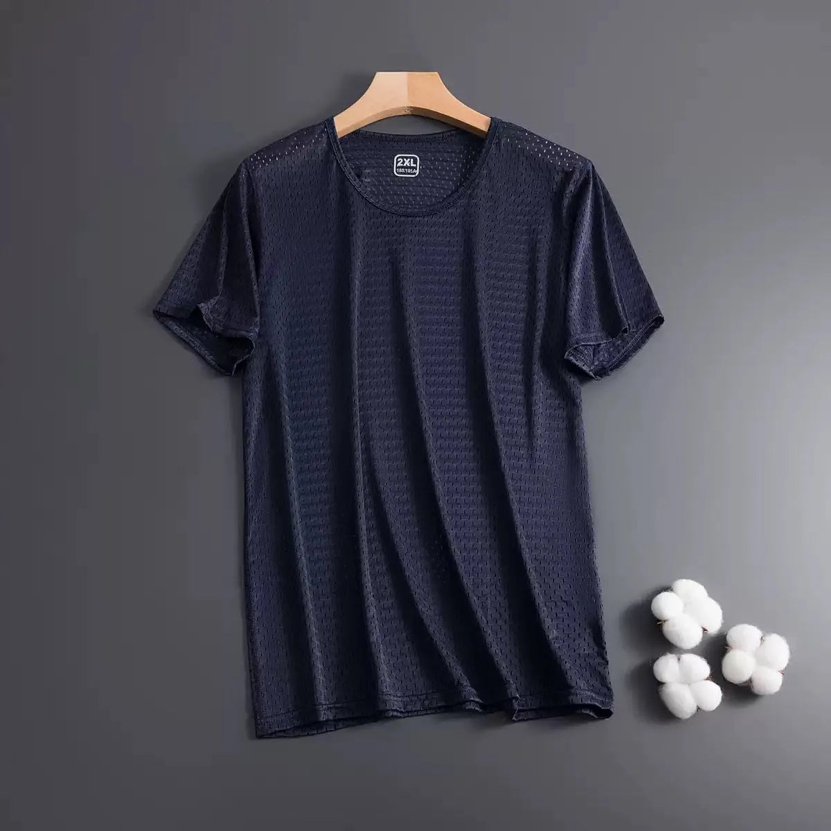 Man wearing a solid colour ice silk short sleeve t-shirt with a crew neck in a loose, casual fit for summer.