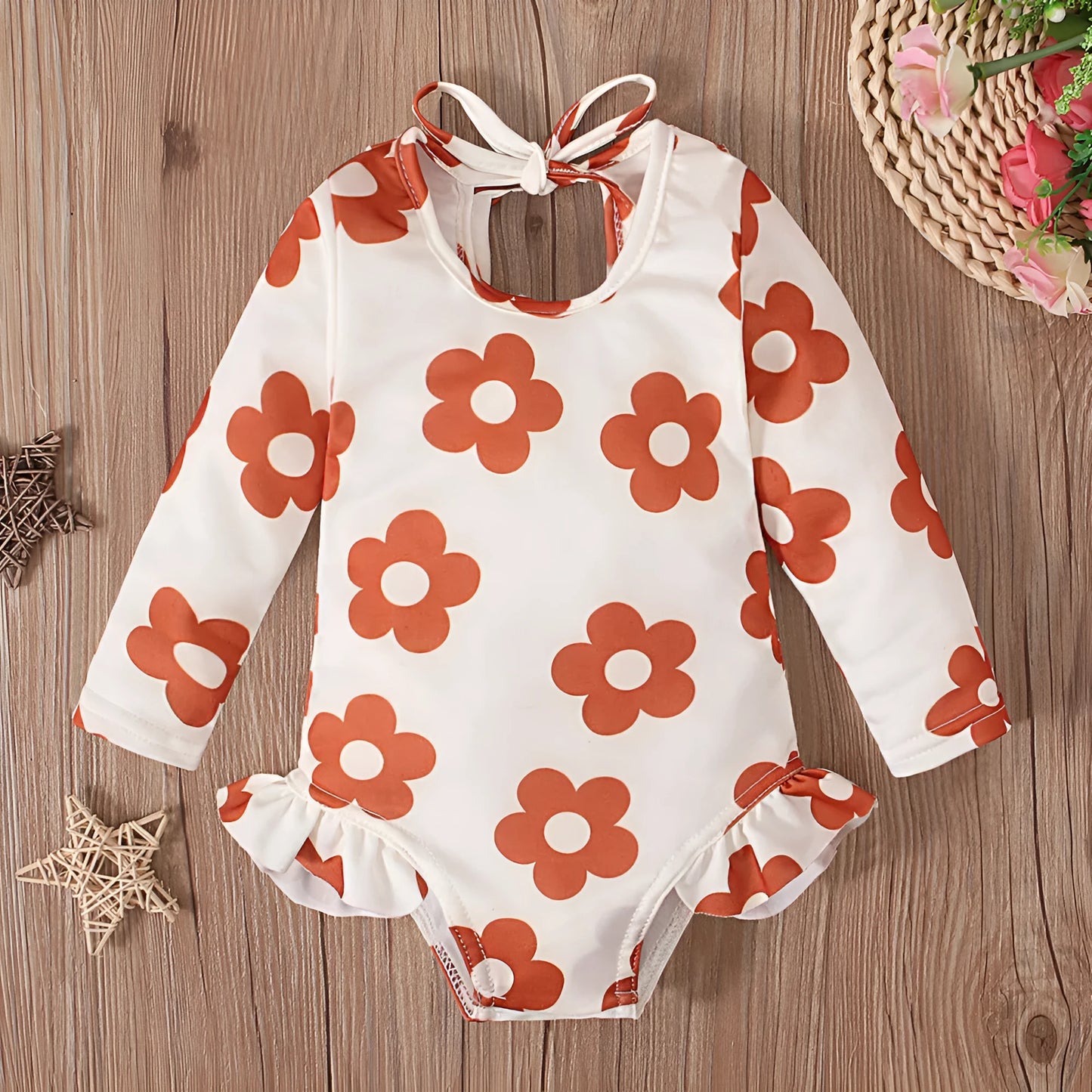 Girl's floral print swimsuit with open back crew neck design in polyester fabric