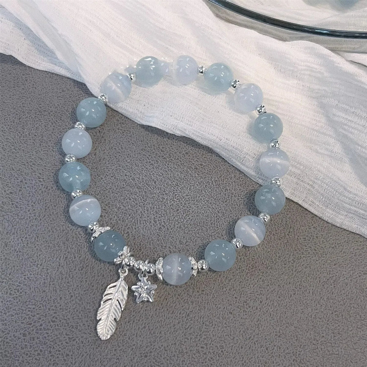 Small white girl crystal bracelet with blue moonlight feather charm and Korean style design