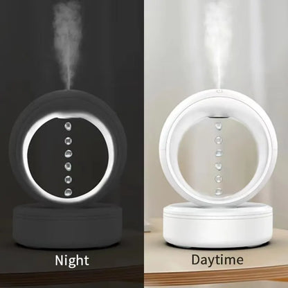 White round anti-gravity desk humidifier showing levitating water droplet effect with USB connection