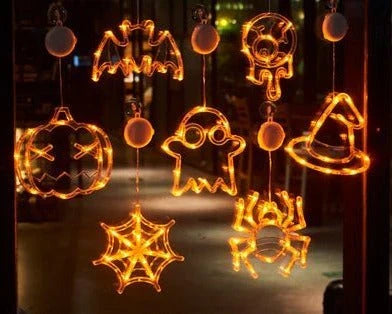 Spooky Halloween window lights featuring ghostly silhouettes, carved pumpkins, and creepy spiders for festive seasonal decor