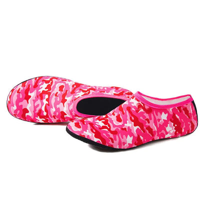 Pair of snorkeling diving socks in camouflage red, 2.5mm rubber and Lycra, non-slip sole, shown flat.