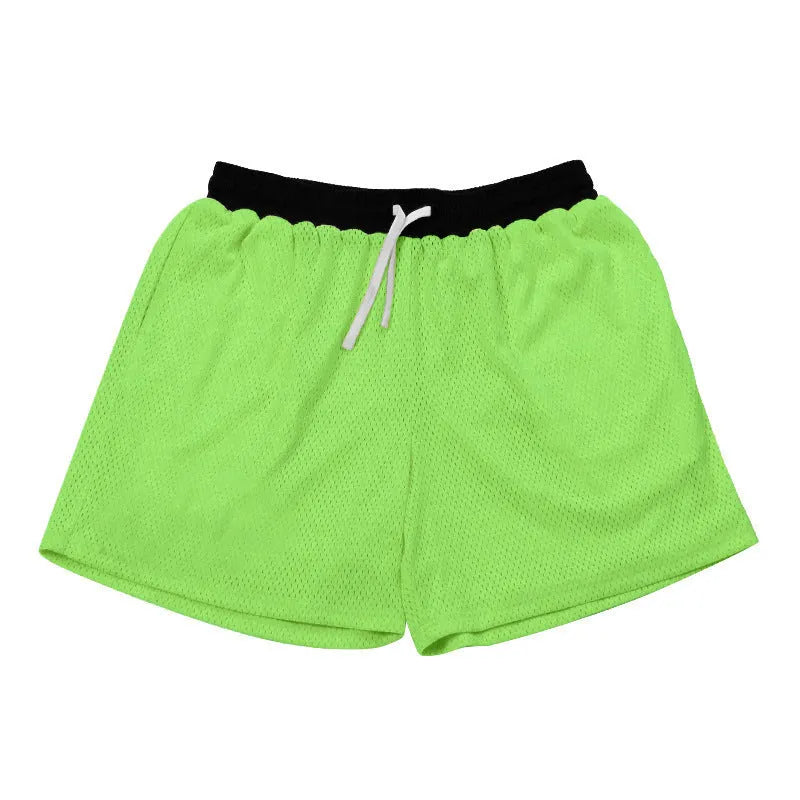 Men's black mesh athletic shorts with built-in liner on a grey background.