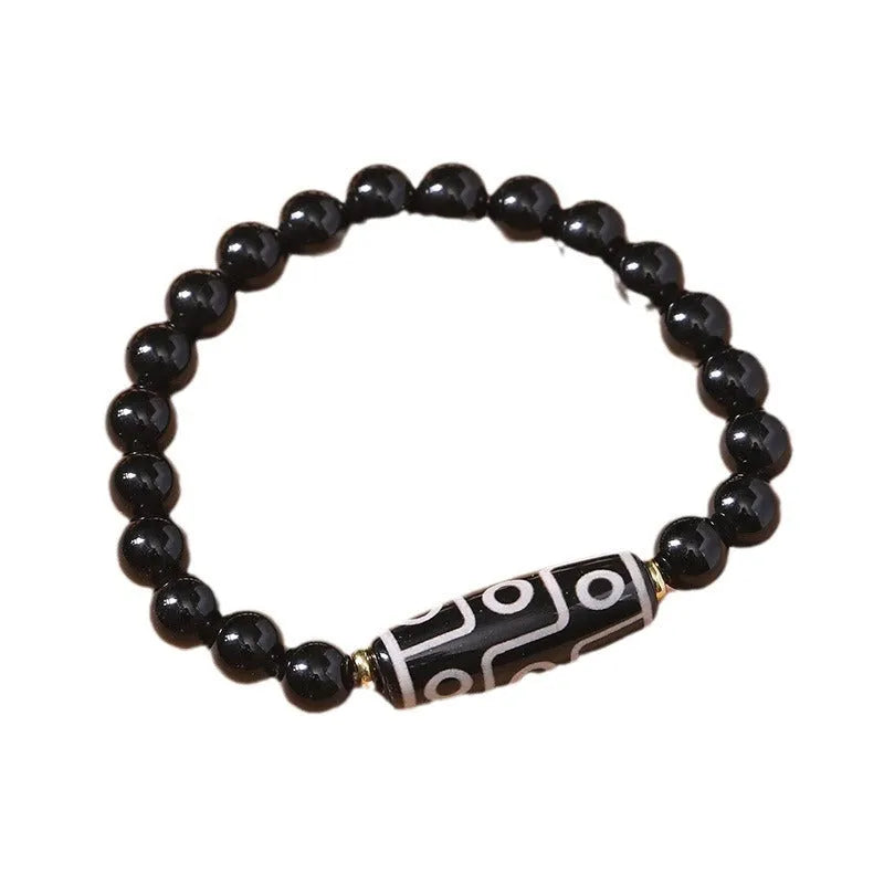 Obsidian-coloured agate Tibet dzi bead bracelet with traditional ethnic design