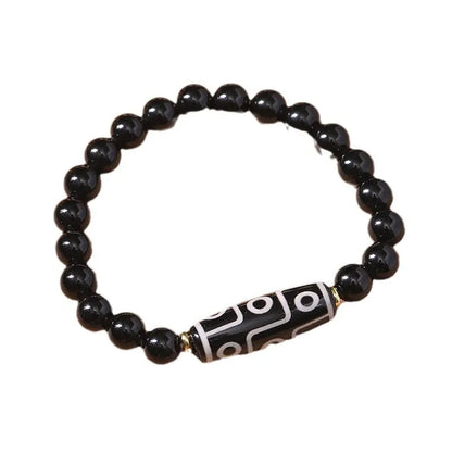Obsidian-coloured agate Tibet dzi bead bracelet with traditional ethnic design