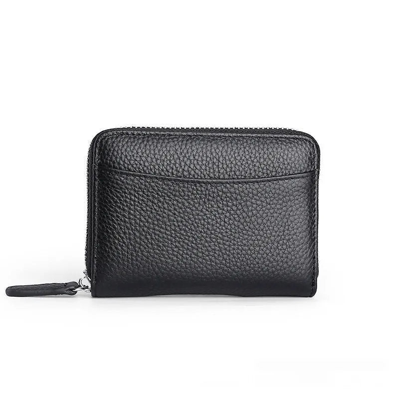 Genuine leather zipper coin purse in a solid colour showing sewing line detail.