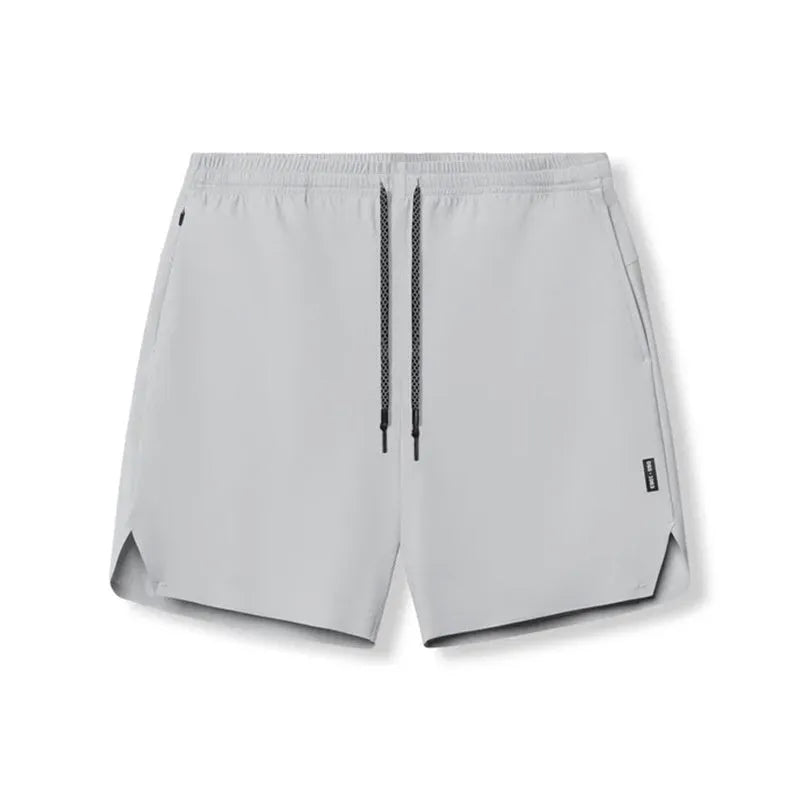 Men's seamless grey sports shorts in straight leg, knee-length quick-dry polyester design.
