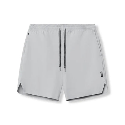 Men's seamless grey sports shorts in straight leg, knee-length quick-dry polyester design.