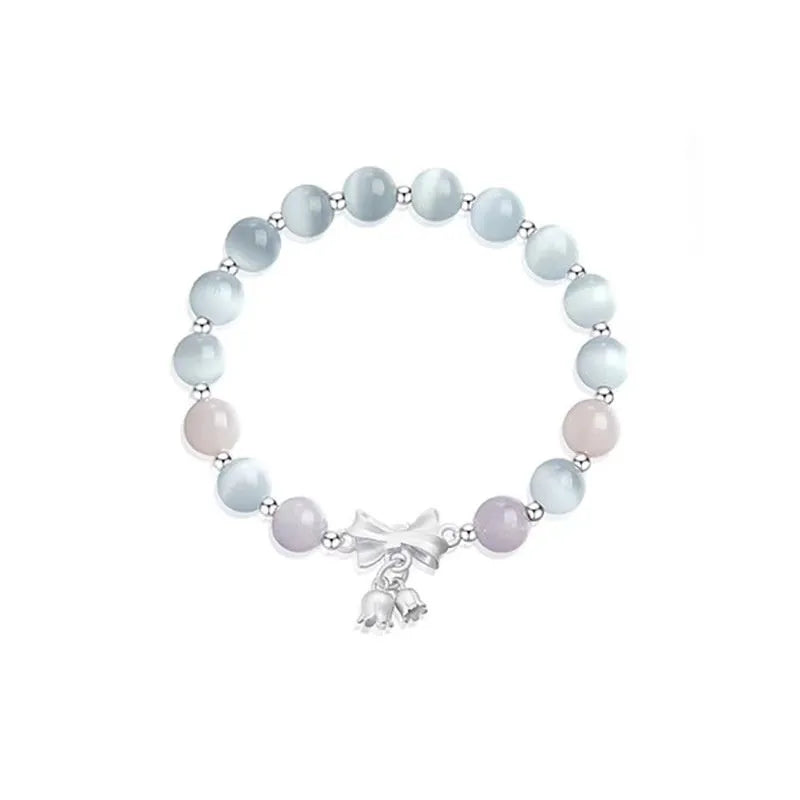 Lavender amethyst opal bracelet with crystal bowknot charm measuring 10mm