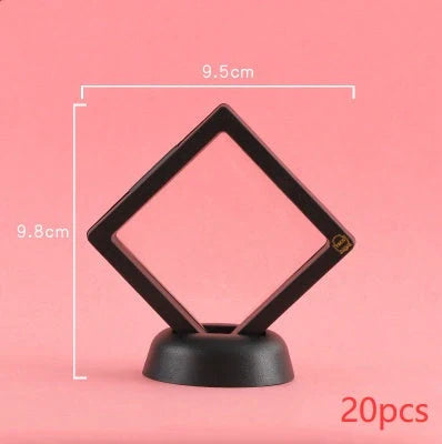 3D floating jewelry coin display stand in white and black, showcasing collectibles in mid-air