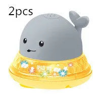 Grey or white electric whale bath toy spraying water with LED lights on a base.