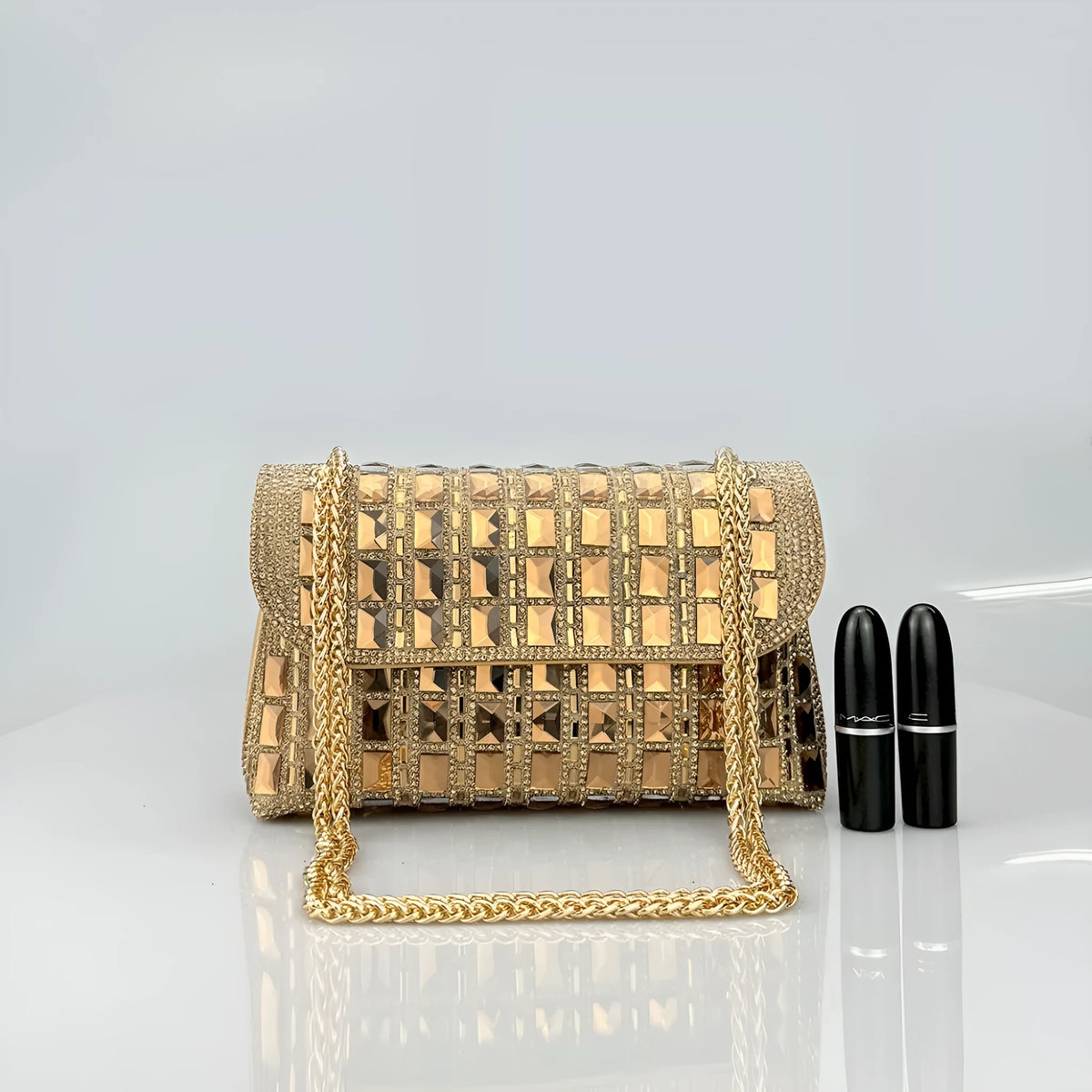 Silver rhinestone-decorated PU leather clutch bag with a metal chain strap, shown open to reveal interior phone pocket.