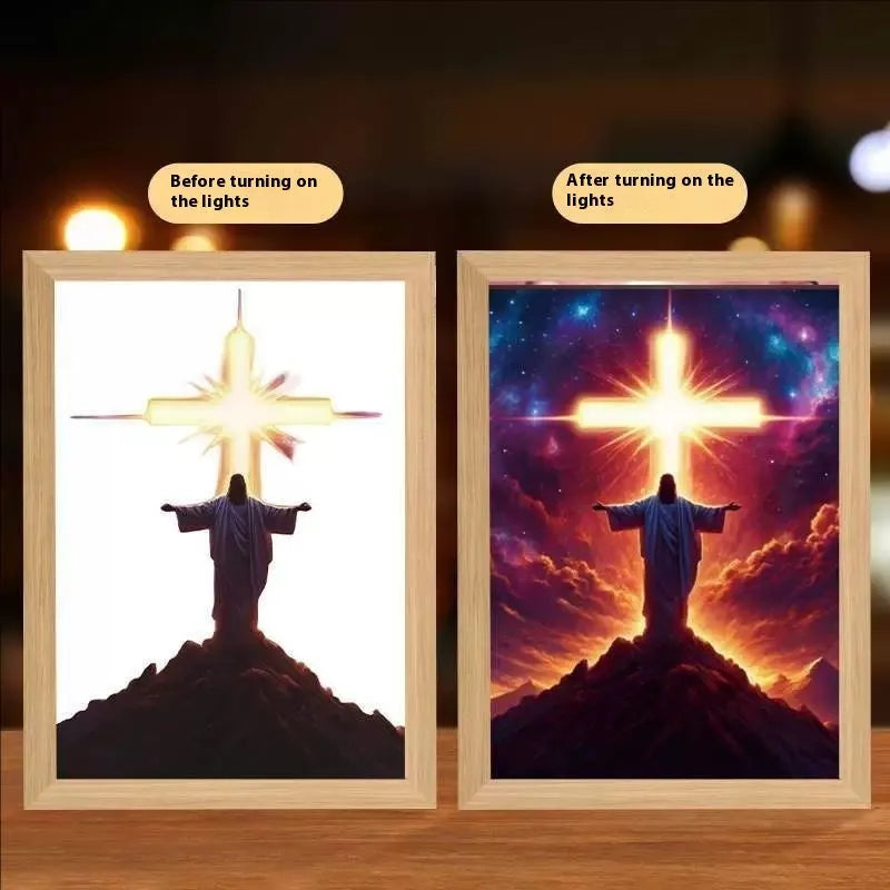 Modern rectangular light painting photo frame displaying an illuminated cross and scenic artwork.