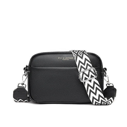 Stylish crossbody bag with rhombus embroidery, wide adjustable shoulder strap, and multiple interior pockets in various color options