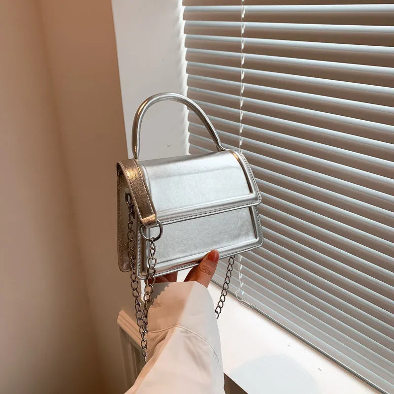Retro horizontal square PU crossbody bag in multiple colours with sewn detail.
