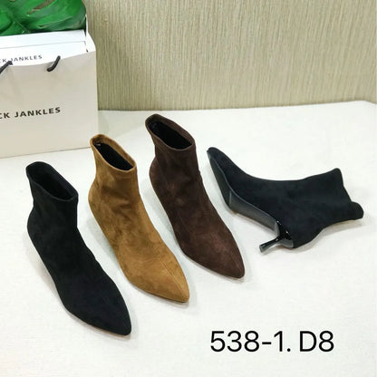Women's black pointed toe ankle boots with a stiletto heel on a neutral background