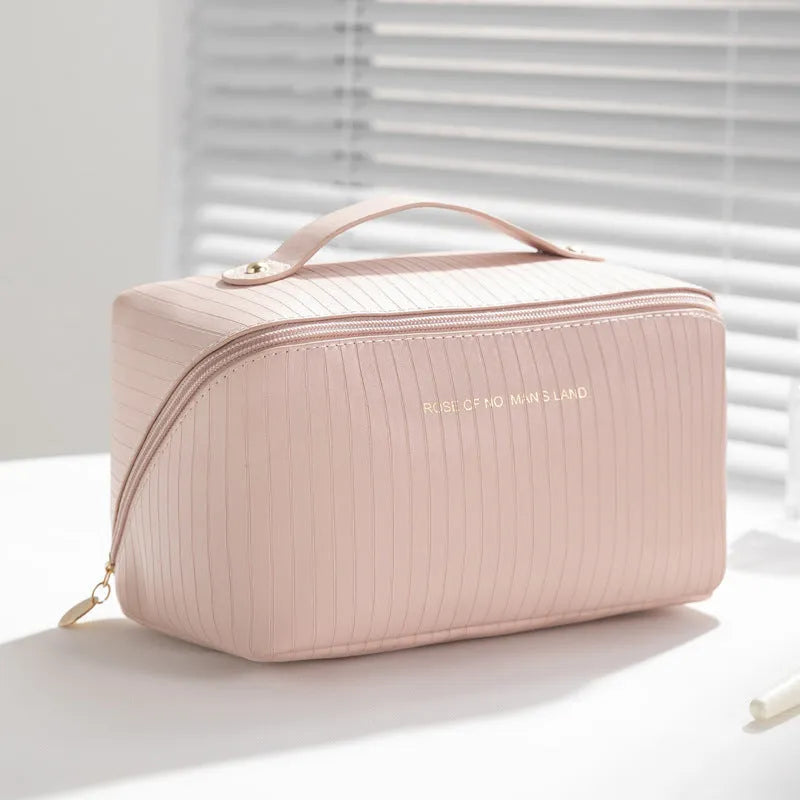 Beige cubic makeup bag with vertical pattern measuring 22.5 by 12.5 by 12.5 centimetres