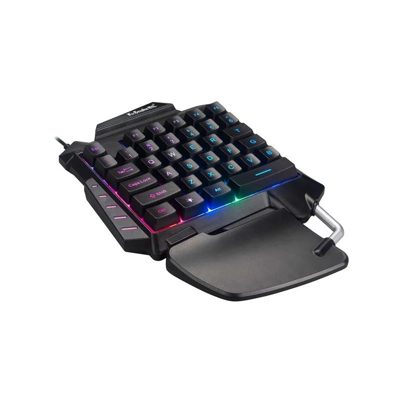Black one-handed gaming keyboard with left-hand controls and integrated throne converter for desktop PC
