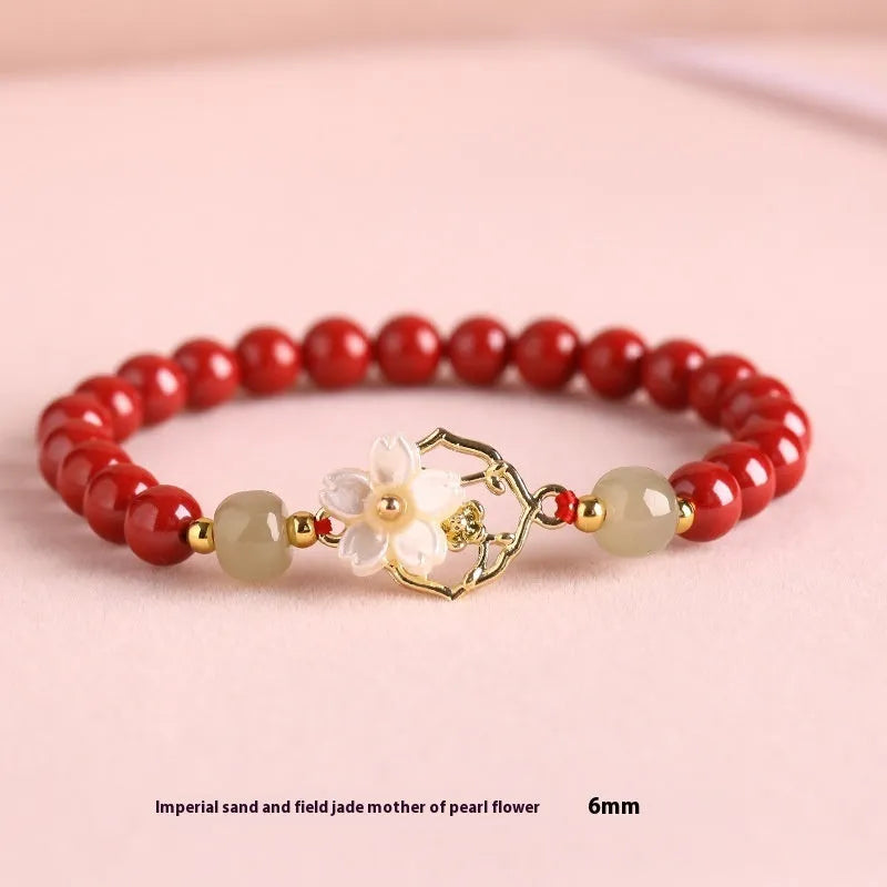 Handcrafted cinnabar bracelet with Hetian jade elements and lotus motifs in New Chinese style showing purple gold sand and emperor sandstone colour options