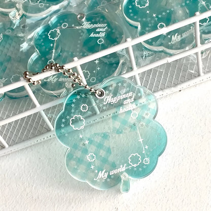 Four-leaf clover shaped acrylic phone pendant keychain in blue, green, and mint colour options