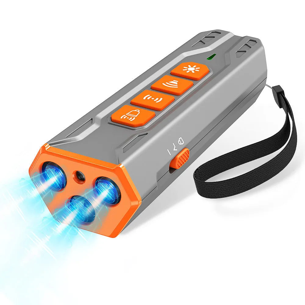 Handheld grey and orange ultrasonic dog trainer with three heads and a remote control.