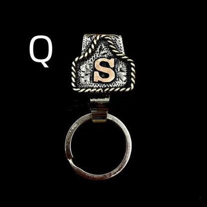 Handmade cow tag design metal keychain on a keyring, shown in one of many available colours.