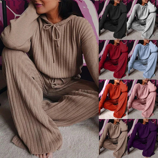 A stylish two-piece casual set featuring a hooded top with long sleeves and matching bottoms in a variety of vibrant colors.