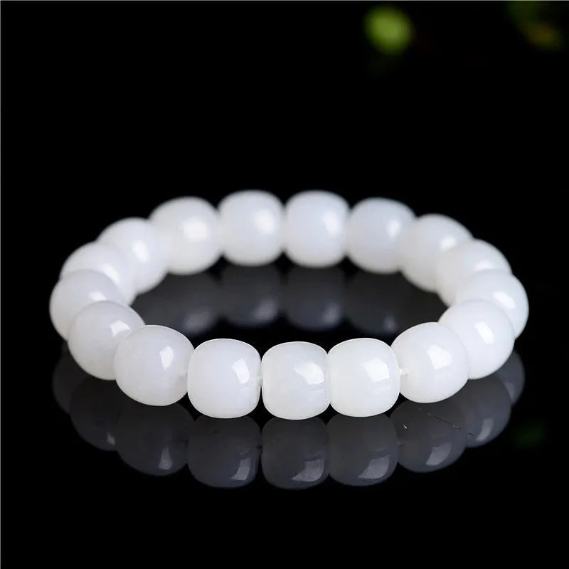 White jade barrel beads bracelet with Hetian jade beads in 5x6mm, 7x8mm, or 8x10mm sizes on a wrist