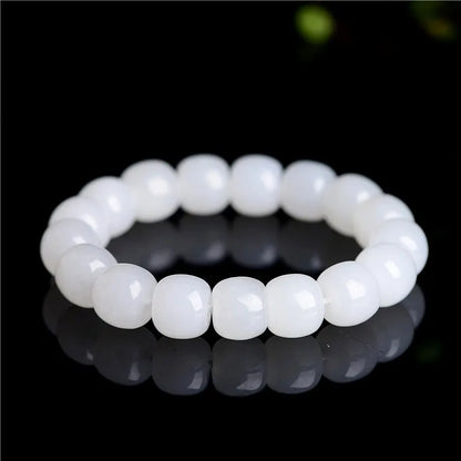 White jade barrel beads bracelet with Hetian jade beads in 5x6mm, 7x8mm, or 8x10mm sizes on a wrist