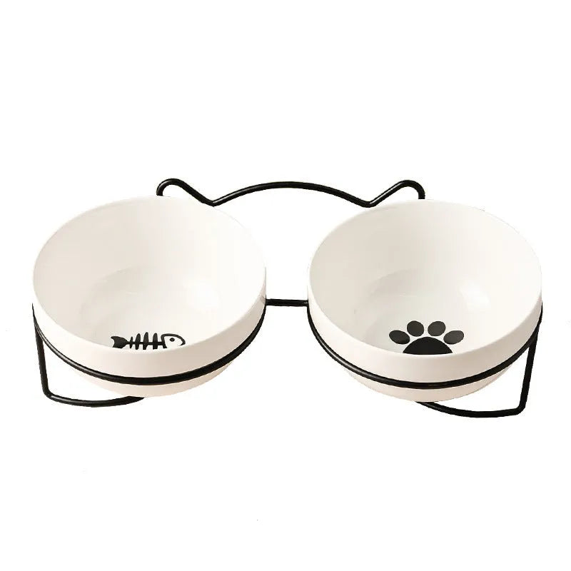 White ceramic pet bowl with cat paw print in a black iron stand with cat ear details