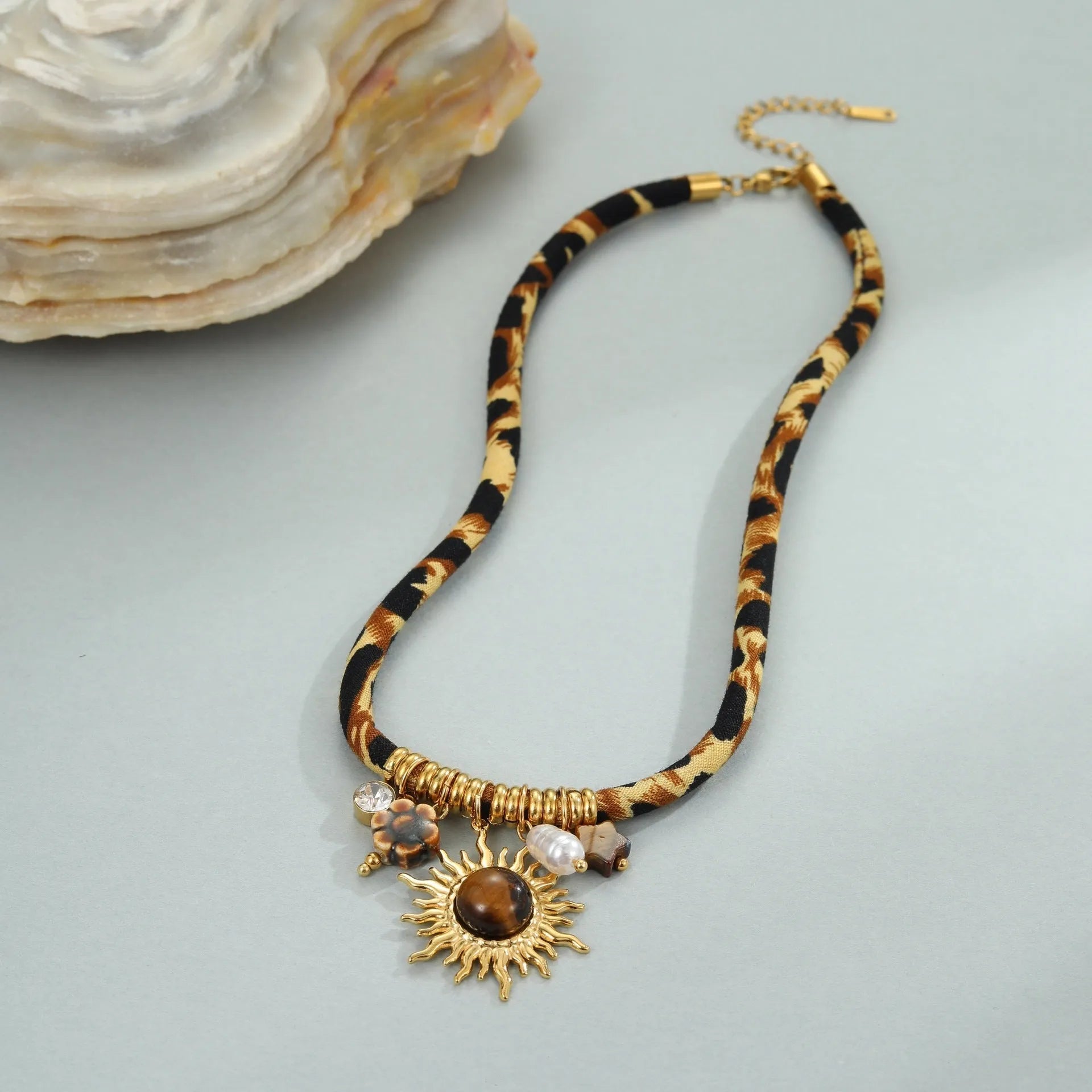Stainless steel necklace with geometric leopard pendant on adjustable chain, 18K electroplated finish