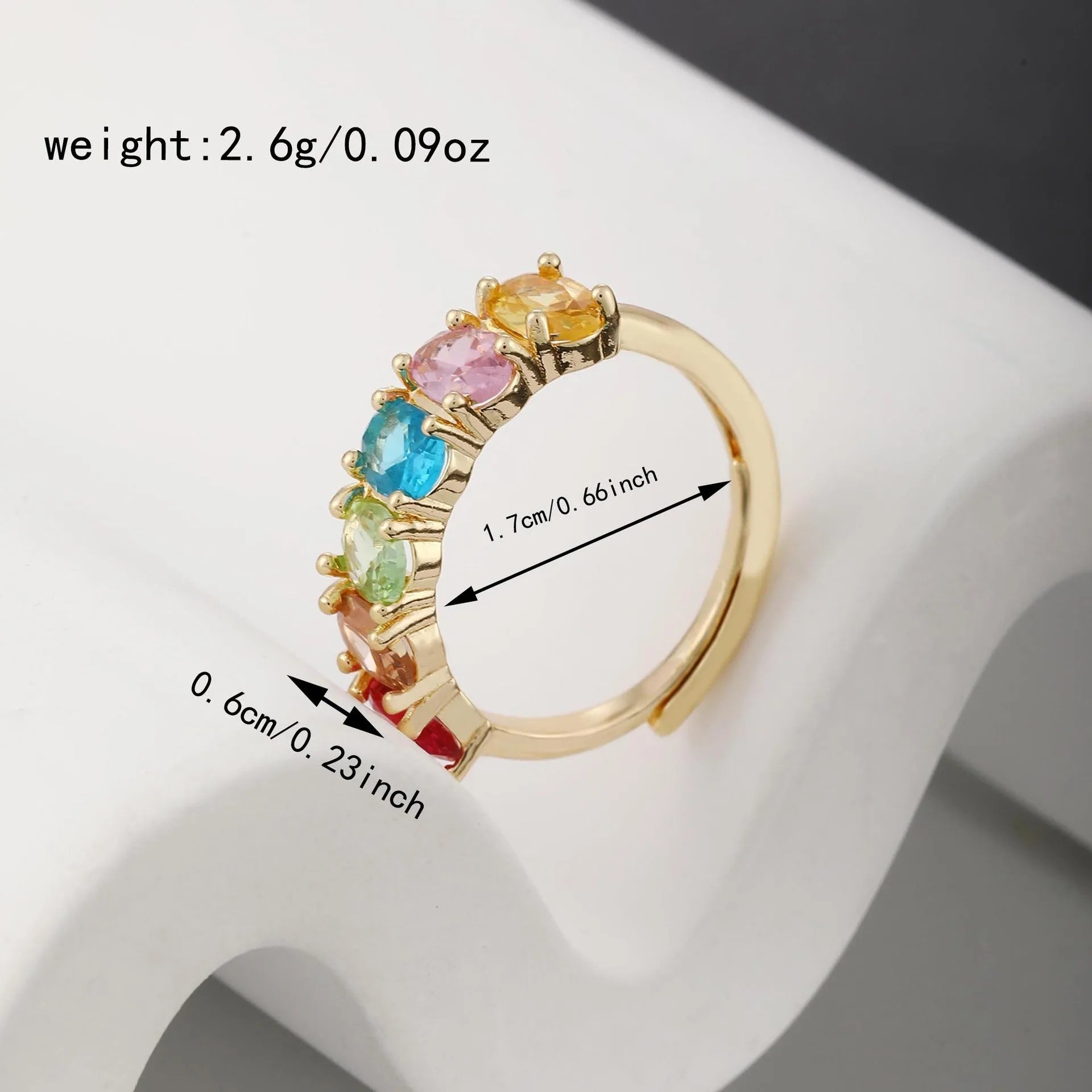 Adjustable gold-colour copper ring with zircon detail on woman's finger