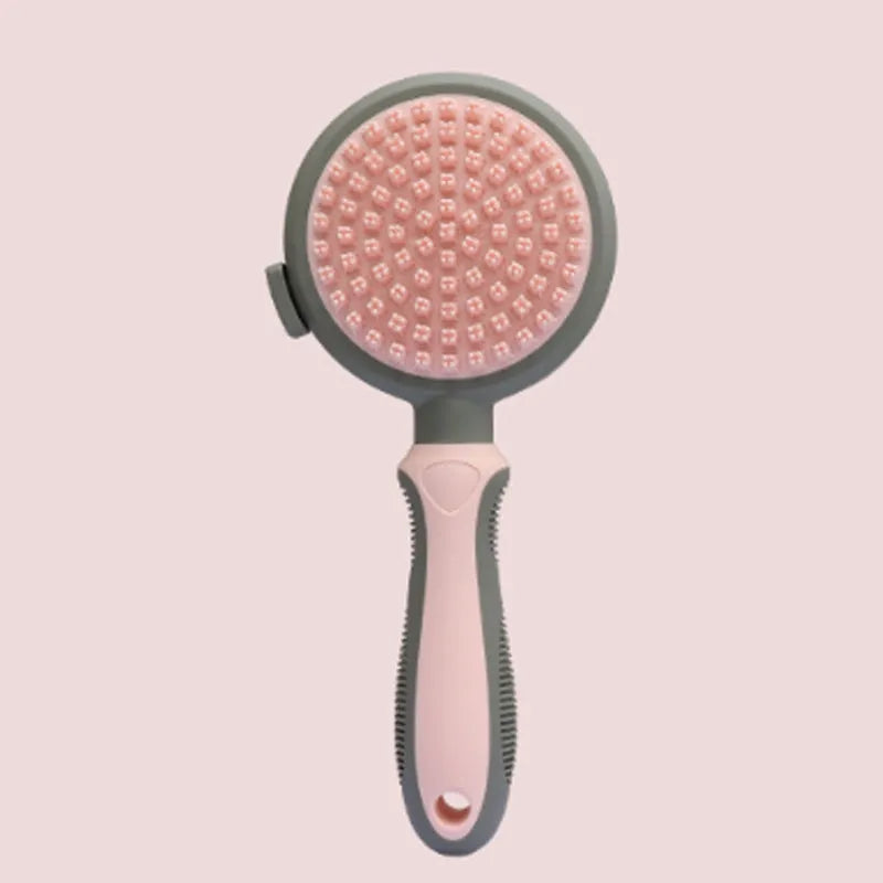 Green and pink dual-sided pet brush showing slicker pins and silicone massage nubs on a wooden table.