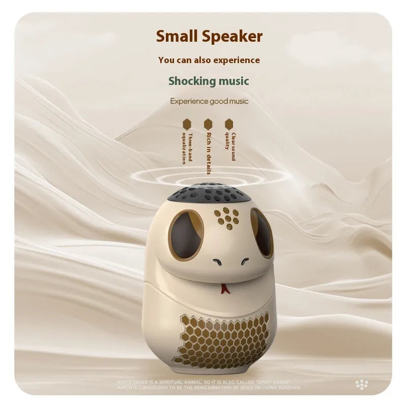 Small white waterproof Bluetooth speaker with LED lights showing TF card slot and USB charging port