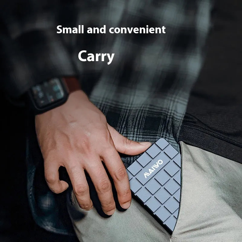 Slim aluminium USB4 hard disk enclosure for M.2 NVMe SSDs, shown next to a laptop.