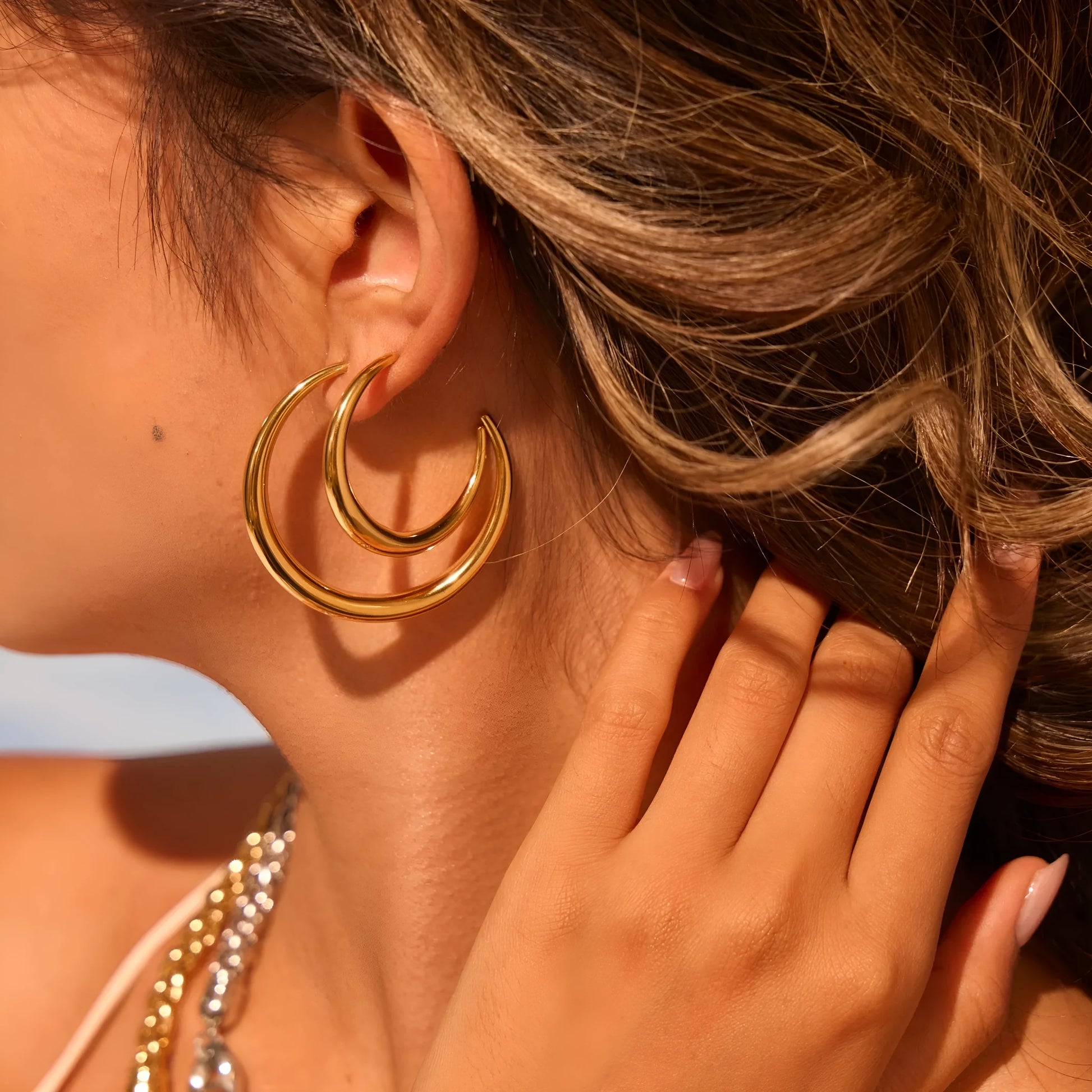 Titanium steel geometric round hoop earrings with 18K gold plating available in large and small sizes