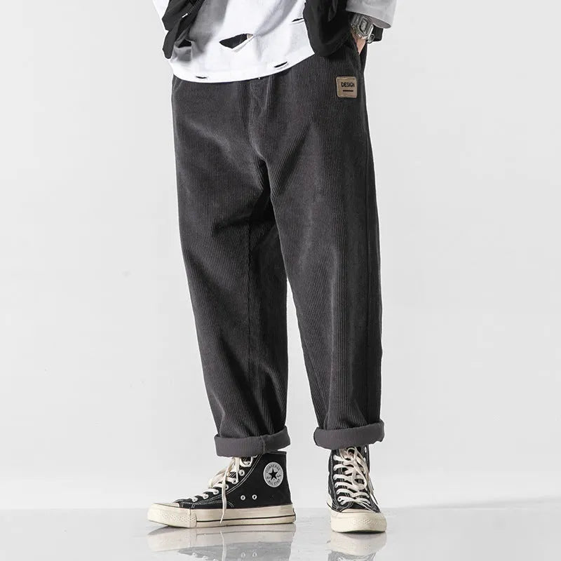 Men's loose fit corduroy sports trousers in Army Green colour with straight leg design and elasticated waist