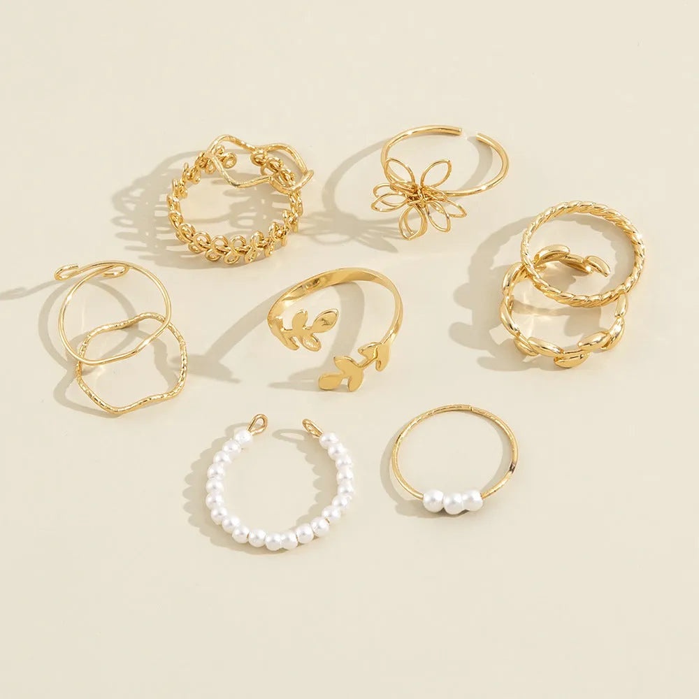 Gold openwork flower pattern ring set with electroplated glossy finish