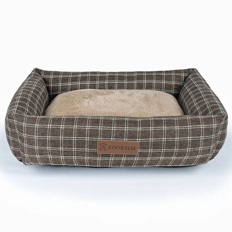 Grey linen-look square dog bed for medium-sized dogs on a wooden floor