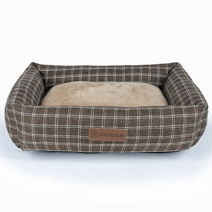 Grey linen-look square dog bed for medium-sized dogs on a wooden floor