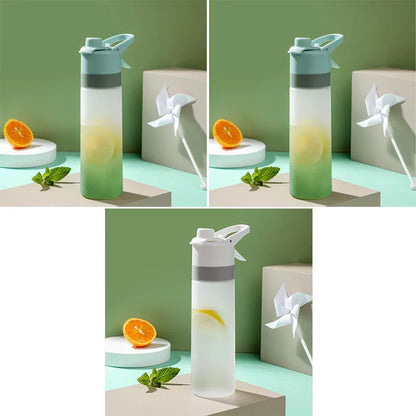 White spray water bottle with black leakproof lid and handle strap on a table