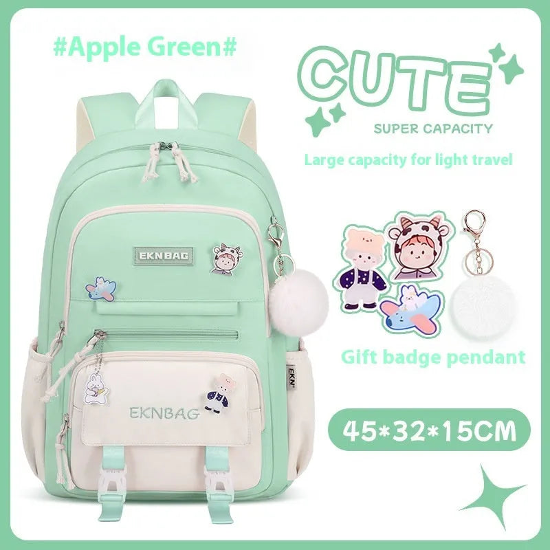 Pink girls school backpack with curved shoulder straps on a wooden floor