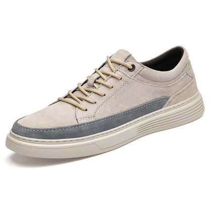 Men's grey low-top casual leather skate shoes with round toe and flat rubber sole on a neutral background.
